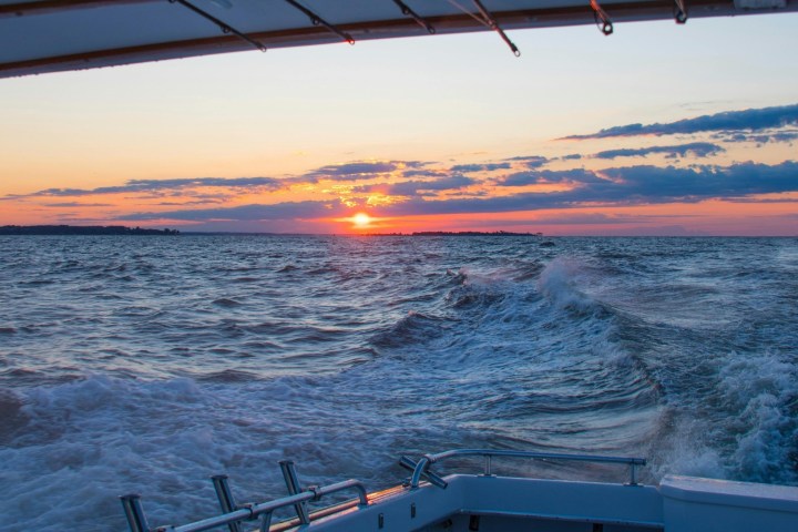 a sunset over a body of water