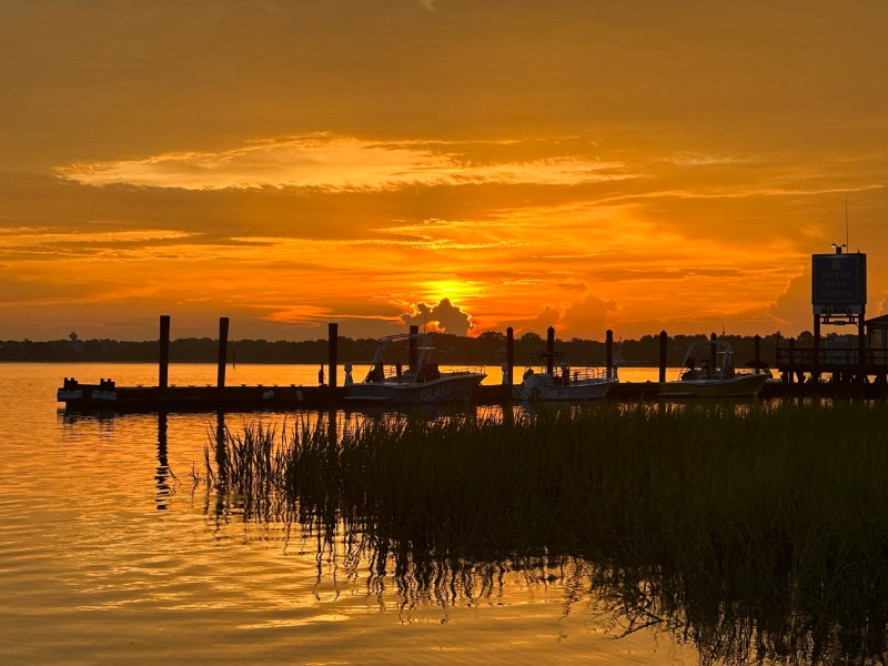 a sunset over a body of water